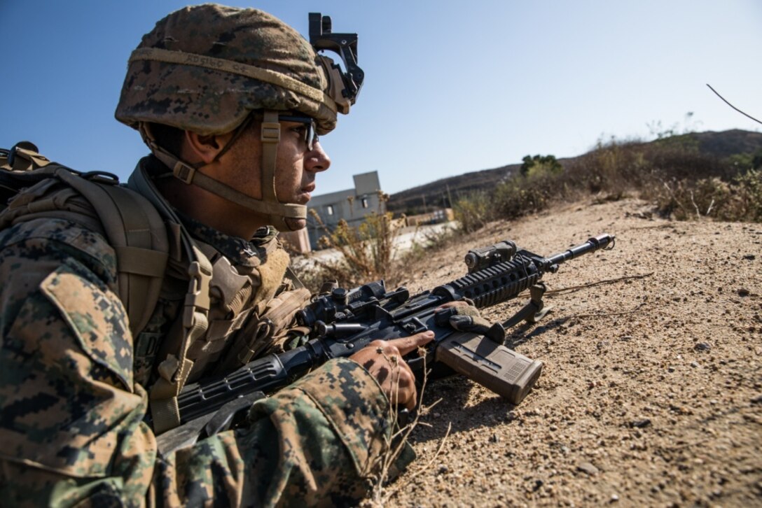 U.S. Navy HM3 Ruben De La Torre, a corpsman with 1st Battalion, 5th Marine Regiment, 1st Marine Division, posts security during the Marine Corps Combat Readiness Evaluation (MCCRE) on Marine Corps Base Camp Pendleton, California, Sept. 21, 2019. 5th Marines conducted a regimental-sized MCCRE that included 1st Battalion, 5th Marines, 2nd Battalion, 5th Marines, and the Regimental Headquarters to increase the combat proficiency and readiness of the regiment. The MCCRE took place over a 10-day period and served as a proof of concept for future regimental-sized MCCREs. (U.S. Marine Corps photo by Lance Cpl. Alexa M. Hernandez)
