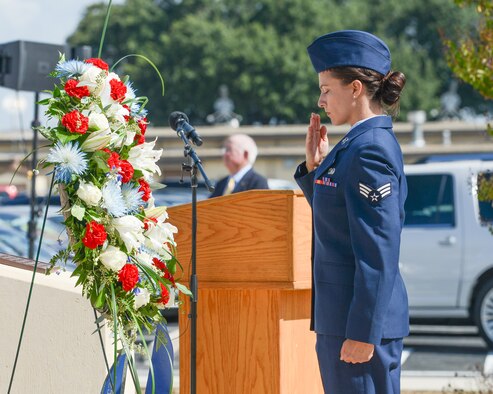 A U.S. Air Force Airman with the Twenty-Fifth Air Force salutes a wreath laid in tribute during the annual headquarters remembrance ceremony at Joint Base San Antonio-Lackland, Texas, Oct. 4, 2019. More than 5,600 of the community’s brothers and sisters have perished, and the names of more than 130 of the most recent losses were read during the ceremony. (U.S. Air Force photo by Sharon Singleton)