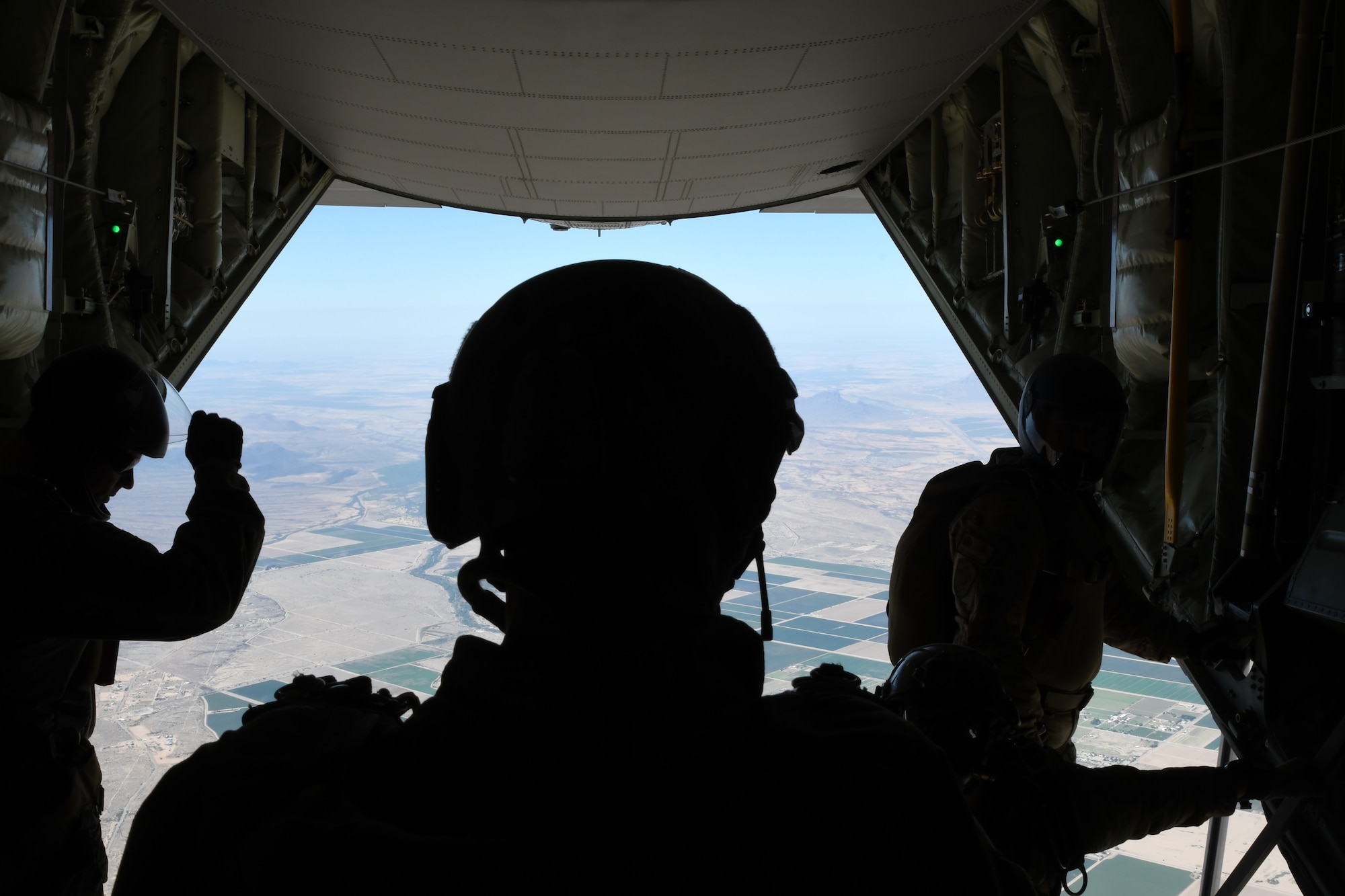 Students of the Guardian Angel Military Freefall Jumpmaster Course perform a freefall jump over Marana, Arizona, Oct. 3, 2019. The training in the course includes teaching different jumping techniques, familiarizing jumpers with different pieces of equipment, executing the directing of jumpers to a designated release point and accomplishing two live jumps. (U.S. Air Force photo by Airman 1st Class Blake J. Gonzales)