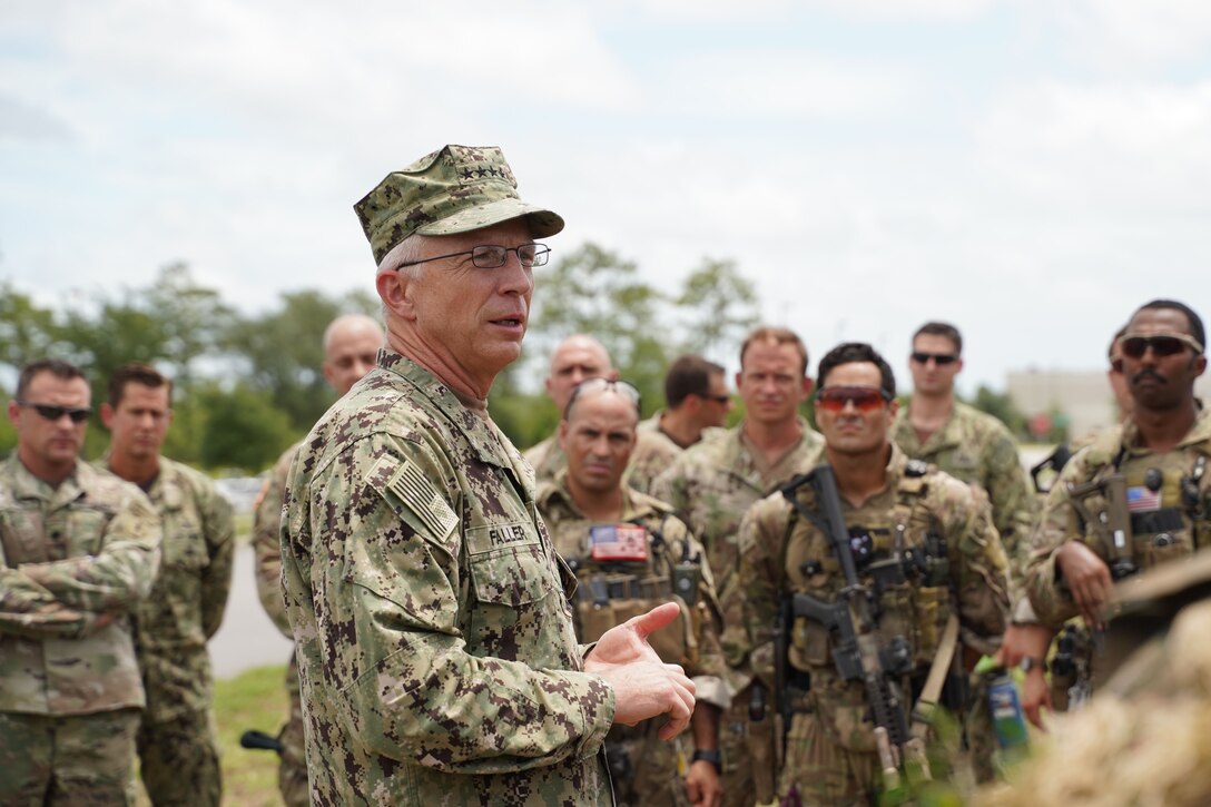 Navy Adm. Craig Faller, commander of U.S. Southern Command, talks with soldiers.