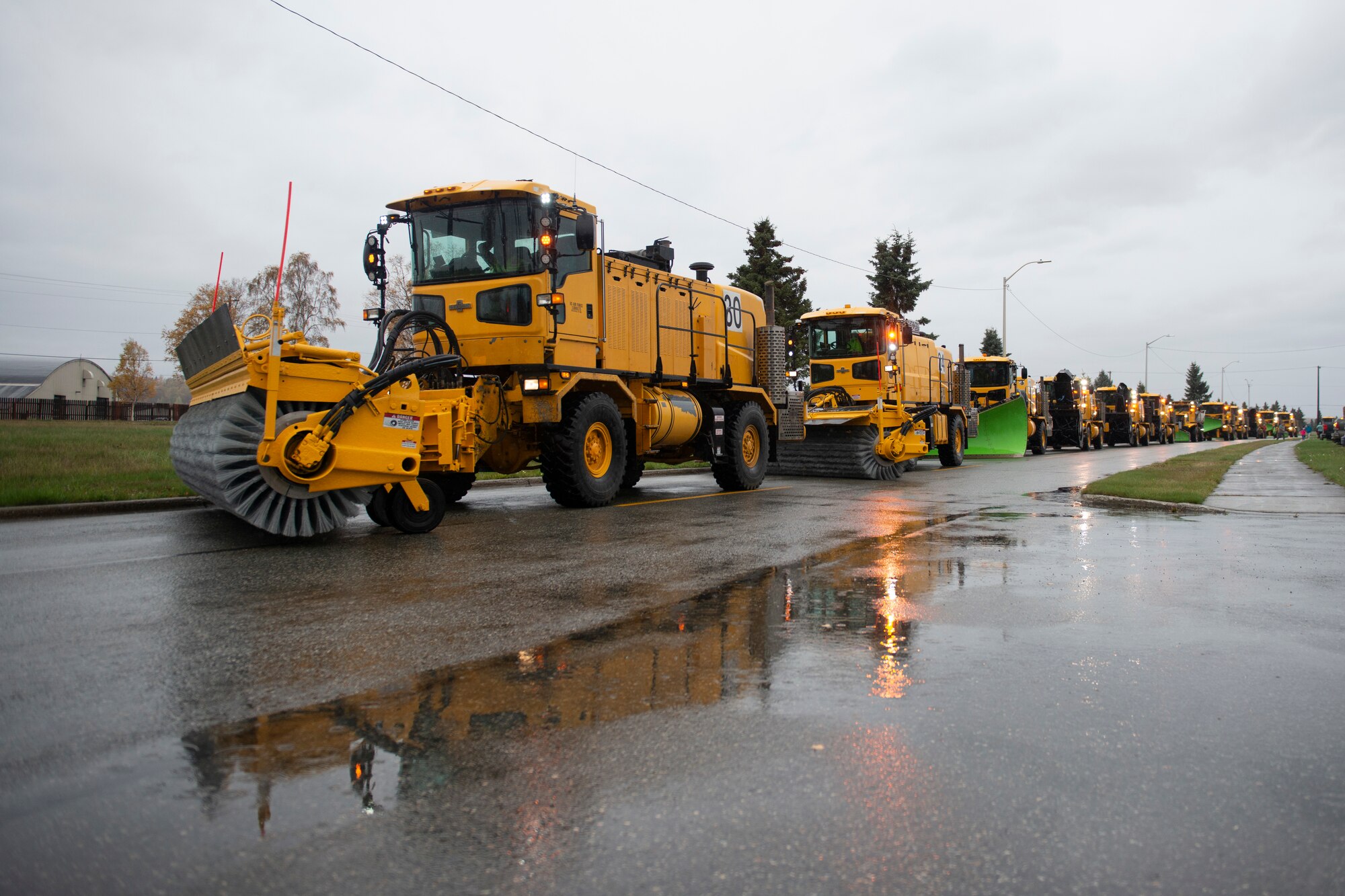 A member of the 773d Civil Engineering Squadron operates snow removal equipment during the annual Snow & Ice Parade on Joint Base Elmendorf-Richardson, Alaska, Oct. 4, 2019. The parade showcased the snow-removal vehicles snow barn personnel use to keep the airfield operational and the roads cleared.