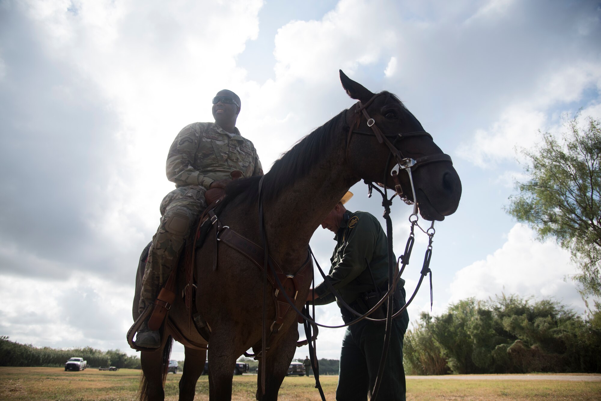 Command Chief Master Sgt. Robert Zackery III, 47th Flying Training Wing command chief saddles up during the Del Rio Border Patrol Sector immersion tour Oct. 4, 2019 in Del Rio, Texas. "Interagency cooperation is super important," Zackery said. "One of the elements of power is the military, so understanding the other agencies such as the Department of State, the Department of Homeland Security, is vital to our national security." (U.S. Air Force photo by Staff Sgt. Benjamin N. Valmoja