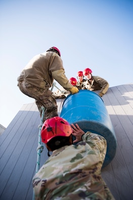 U.S. Air Force Airmen from the 366th Fighter Wing attempt to complete an obstacle September 30, 2019, at the Leadership Reaction Course (LRC) on Gowen Field, Idado. The LRC is used to develop leadership and followership skills through overcoming obstacles with limited resources while giving participants a chance to adapt and overcome through teamwork. (U.S. Air Force photo by Airman 1st Class Andrew Kobialka)