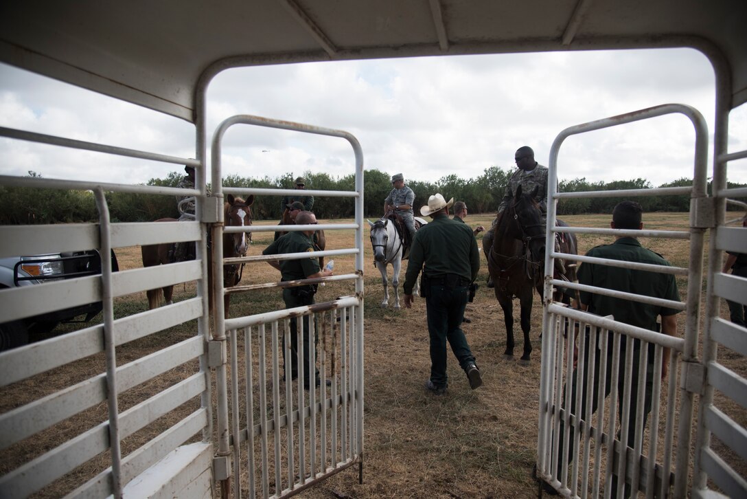 Col. Lee Gentile, 47th Flying Training Wing commander, and Command Chief Master Sgt. Robert Zackery III, 47th FTW command chief saddle up in preparation for the Del Rio Border Patrol Sector immersion tour Oct. 4, 2019 in Del Rio, Texas. "Today was all focused on being able to build partnerships, demonstrating to Laughlin's leadership first-hand the hard work the men and women of the Border Patrol do," said Raul Ortiz, U.S. Border Patrol Del Rio sector chief patrol agent. (U.S. Air Force photo by Staff Sgt. Benjamin N. Valmoja)