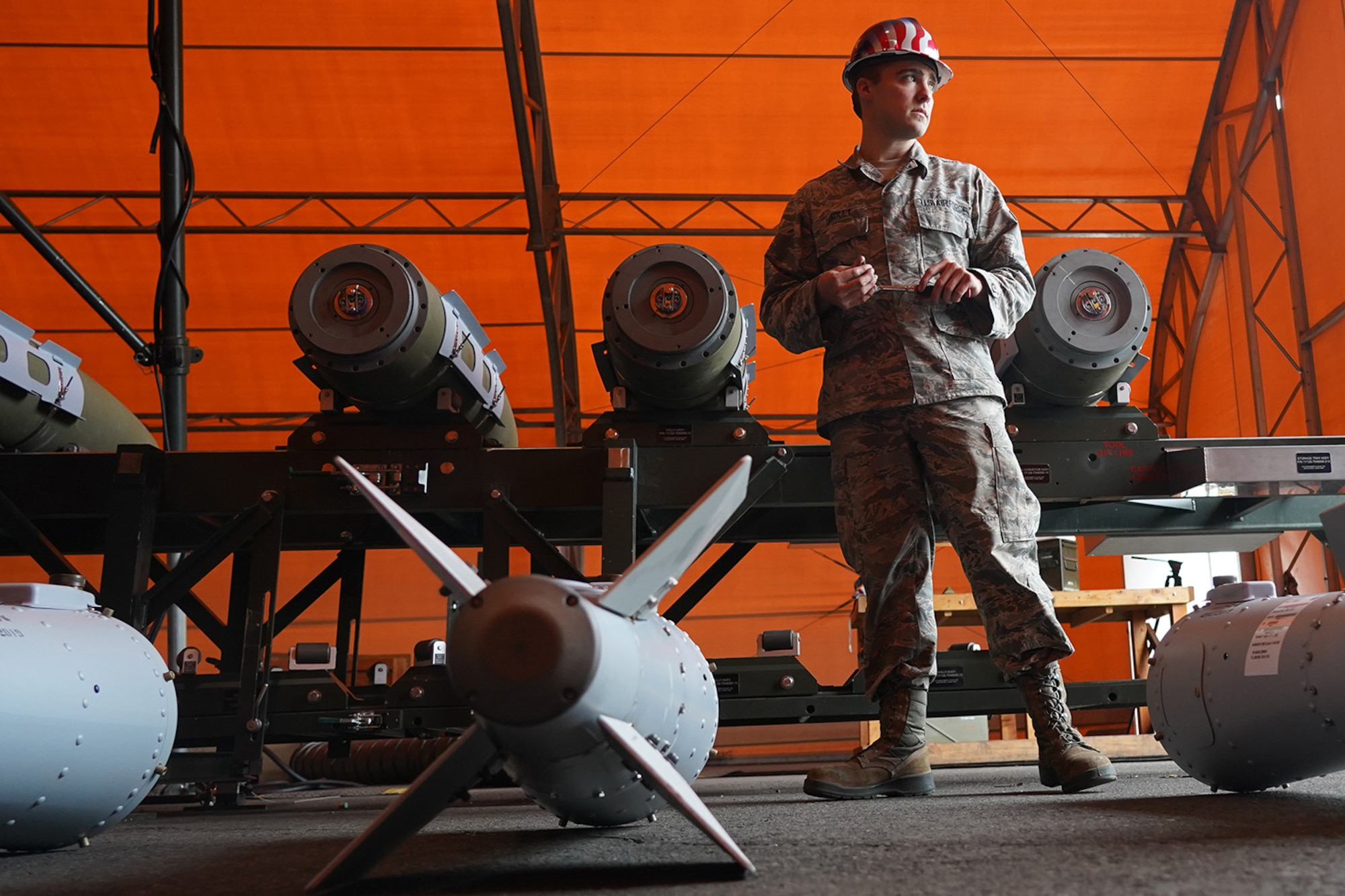 Airman 1st Class Mitchell Bradley, a native of Montgomery, Ala., assigned to the 3rd Munitions Squadron, takes a short break while building GBU-32s (Guided Bomb Units) on Joint Base Elmendorf-Richardson, Alaska, Oct. 2, 2019, during the Polar Force 20-1 exercise. Polar Force 20-1 is designed to exercise multiple elements of the Agile Combat Employment (ACE) concept of operations, which include generating 5th Generation combat power from austere locations, command and control using non-traditional methods, and rapid airlift capabilities to sustain a forward operating location.  The ACE concept enables 3rd Wing to deliver lethal Airpower for America, even in a contested environment.