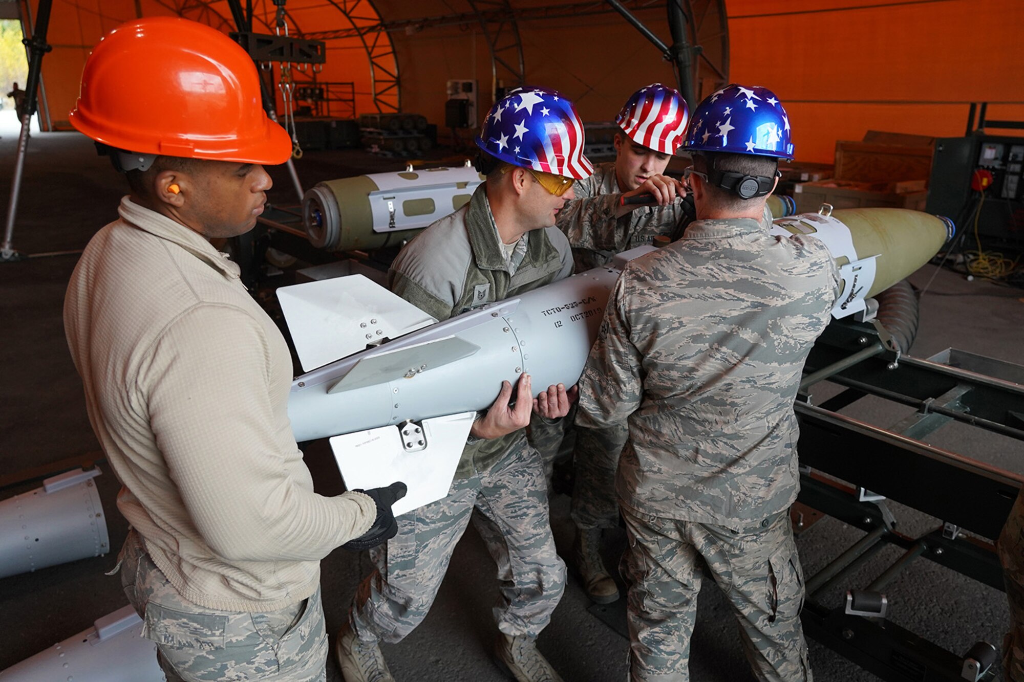 Airmen assigned to the 3rd Munitions Squadron build GBU-32s (Guided Bomb Units) on Joint Base Elmendorf-Richardson, Alaska, Oct. 2, 2019, while participating in the Polar Force 20-1 exercise. Polar Force 20-1 is designed to exercise multiple elements of the Agile Combat Employment (ACE) concept of operations, which include generating 5th Generation combat power from austere locations, command and control using non-traditional methods, and rapid airlift capabilities to sustain a forward operating location.  The ACE concept enables 3rd Wing to deliver lethal Airpower for America, even in a contested environment.