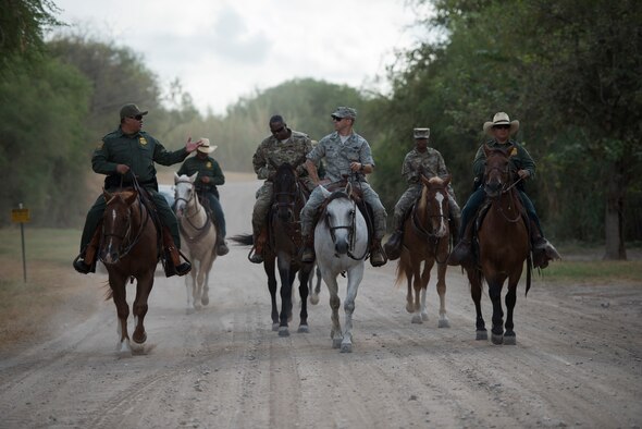 Raul Ortiz, U.S. Border Patrol Del Rio Sector chief patrol agent (left), talks about the Border Patrol’s mission with Col. Lee Gentile, 47th Flying Training Wing commander, during a Border Patrol immersion tour in Del Rio, Texas, Oct. 4, 2019. Del Rio Border Patrol Sector officials invited Laughlin leadership on a tour of operations and a goal to build partnership between the two local agencies. (U.S. Air Force photo by Senior Airman Marco A. Gomez)