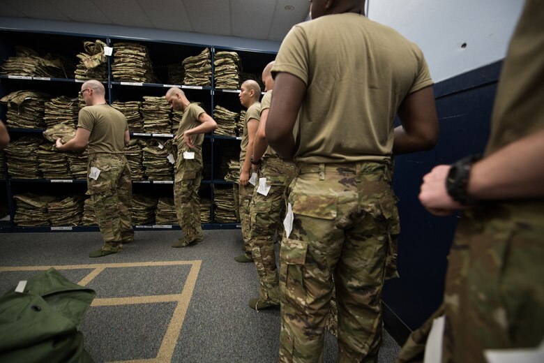 Basic military training trainees receive the first operational camouflage pattern uniforms