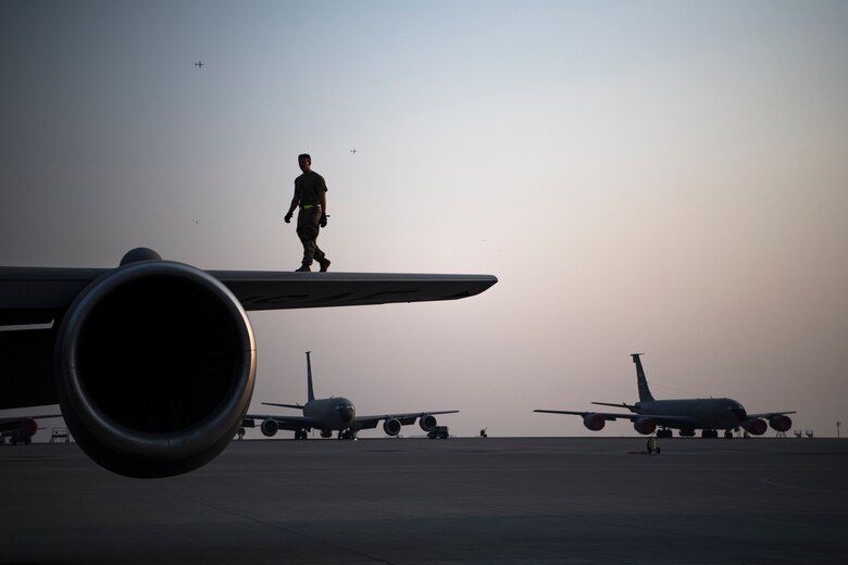 Airman performs post-flight inspections on a KC-135 Stratotanker
