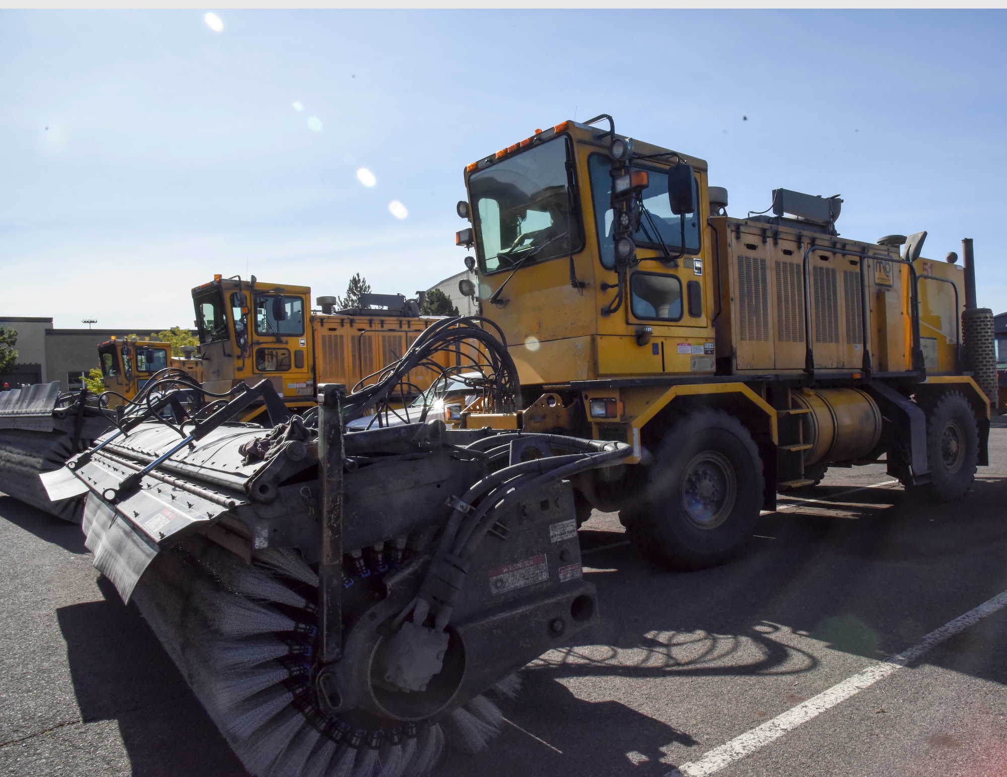 U.S. Air Force Airmen test the engines in an Oshkosh broom sweeper vehicle at the 92nd Logistics Readiness Squadron