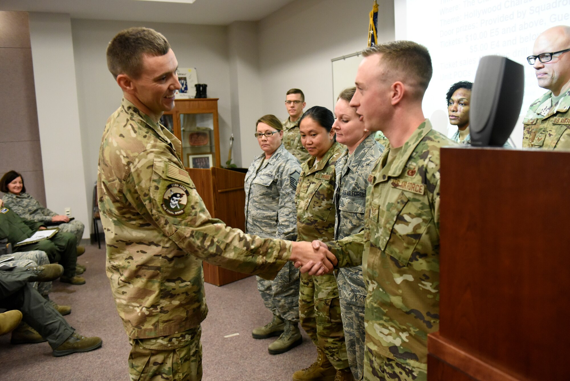 U.S. Air Force Chief Master Sgt. Jeremy Mullins, 118th Air Support Operations Squadron (ASOS) superintendent, coins members at the North Carolina Air National Guard (NCANG) Base, Charlotte Douglas International Airport, Oct. 4th, 2019. Members from the 145th Airlift Wing Contracting office, Finance, and Logistics Readiness Squadron collaborated across the wing to ensure end of year funds were appropriately spent on equipment needed for readiness for the 118th ASOS and 145th Airlift Wing. Members were able to purchase equipment for almost 1,500 members of the NCANG to ensure deployment readiness.