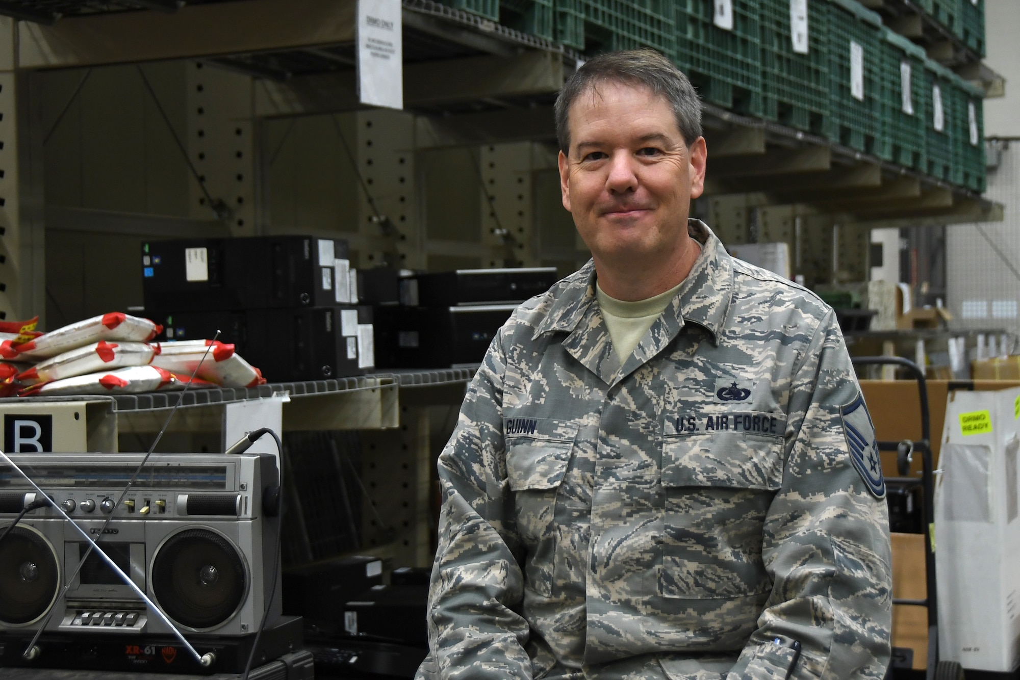 U.S. Air Force Master Sgt. James Guinn, 145th Airlift Wing Logistics Readiness Squadron, posed for a picture in the logistics warehouse after discussing his involvement in the year end fiscal purchases with unexpected funding at the North Carolina Air National Guard (NCANG) Base, Charlotte Douglas International Airport, Oct. 4th, 2019. Members from the 145th Airlift Wing Contracting office, Finance, and Logistics Readiness Squadron collaborated across the wing to ensure end of year funds were appropriately spent on equipment needed for readiness for the 118th ASOS and 145th Airlift Wing. Members were able to purchase equipment for almost 1,500 members of the NCANG to ensure deployment readiness.