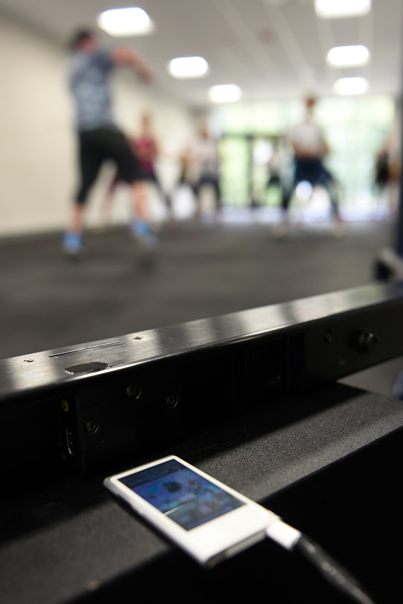 Latin-inspired music streams from a device as members of the North Carolina Air National Guard participate in a National Hispanic Month inspired bootcamp Zumba class instructed by Will Fields, cousin of U.S. Air Force 1st. Sgt. Jorge Bedoya, 145th Medical Group, Oct. 5th, 2019. More than twenty people came out to the class as a means to appreciate another culture, and to enjoy the Hispanic music and exercise.