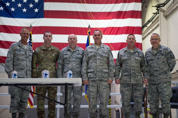 Col. Larry Shaw, 434th Air Refueling Wing commander left and Chief Master Sgt. Wes Marion, 434th Air Refueling Squadron command chief right pose with new chief master sergeants during an induction ceremony here Oct. 6, 2019. Chief Master Sgt. Adam Loos, 434th Civil Engineer Squadron, Chief Master Sgt. James Billing, 434th Maintenance Squadron, Chief Master Sgt. Charles Hoover, 434th Maintenance Group and Chief Master Sgt. Brian Rude, 434th Logistics Readiness Squadron. The new chiefs were among the 73 Airmen who were inducted into the ranks of noncommissioned officers and senior noncommissioned officers. (U.S. Air Force Photo/Tech. Sgt. Jami K. Lancette)