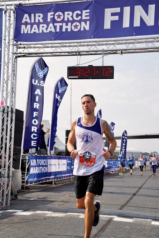 Arizona Air National Guard Master Sgt. Dan Martin, 161st Logistics Readiness Squadron NCO in charge of fuels, crosses the finish line of the Air Force Marathon Sept. 21, 2019. Martin finished the 23rd annual Air Force Marathon with a time of 3:27:07 and placed 49th overall as well as a Major Command team win with the Air National Guard team.