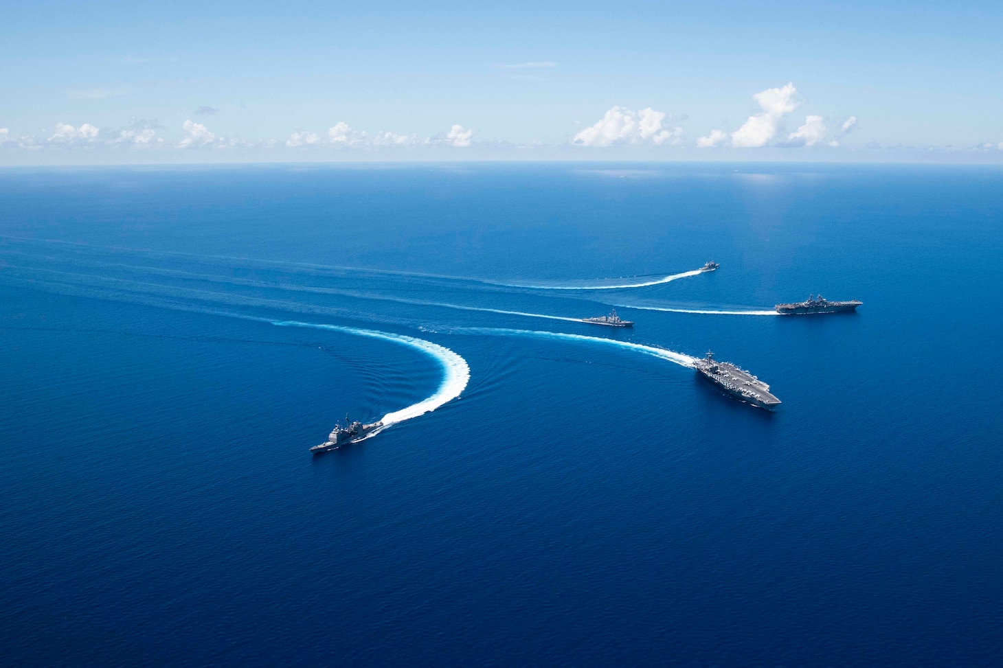 191006-N-VI515-0567 SOUTH CHINA SEA (October 6, 2019) Ships from Ronald Reagan Carrier Strike Group and Boxer Amphibious Ready Group conduct breakaway maneuvers while sailing in formation during security and stability operations in the U.S. 7th Fleet area of operations. U.S. 7th Fleet is the largest numbered fleet in the world, and the U.S. Navy has operated in the Indo-Pacific region for more than 70 years, providing credible, ready forces to help preserve peace and prevent conflict.