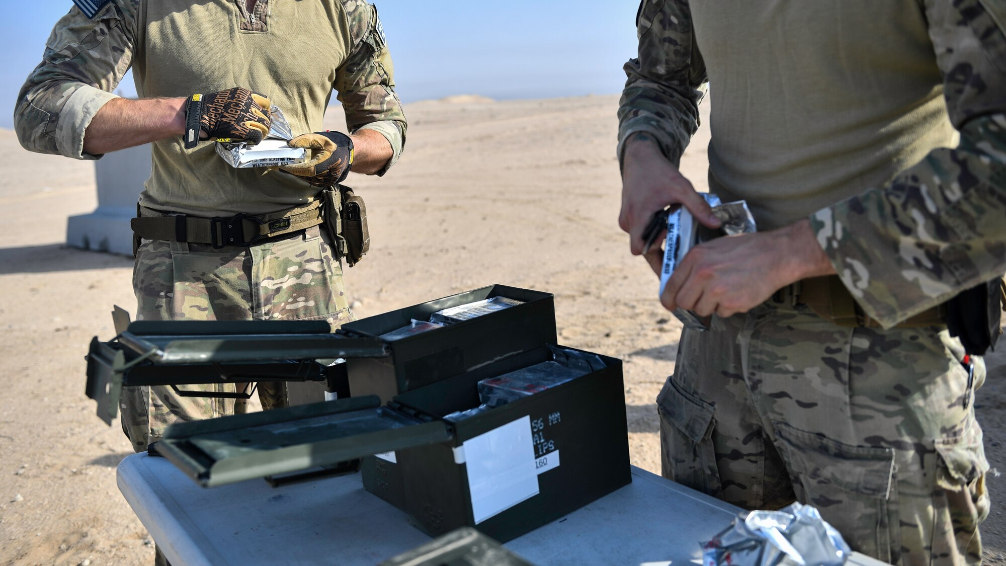 Airmen assigned to the 386th Expeditionary Civil Engineer Squadron explosive ordnance disposal flight at Ali Al Salem Air Base, unpack ignition sources before a rapid airfield damage repair exercise at Udari Range, Kuwait, Sept. 25, 2019. Igniters are used as a pyrotechnic device to light the fuse to detonate the explosives.