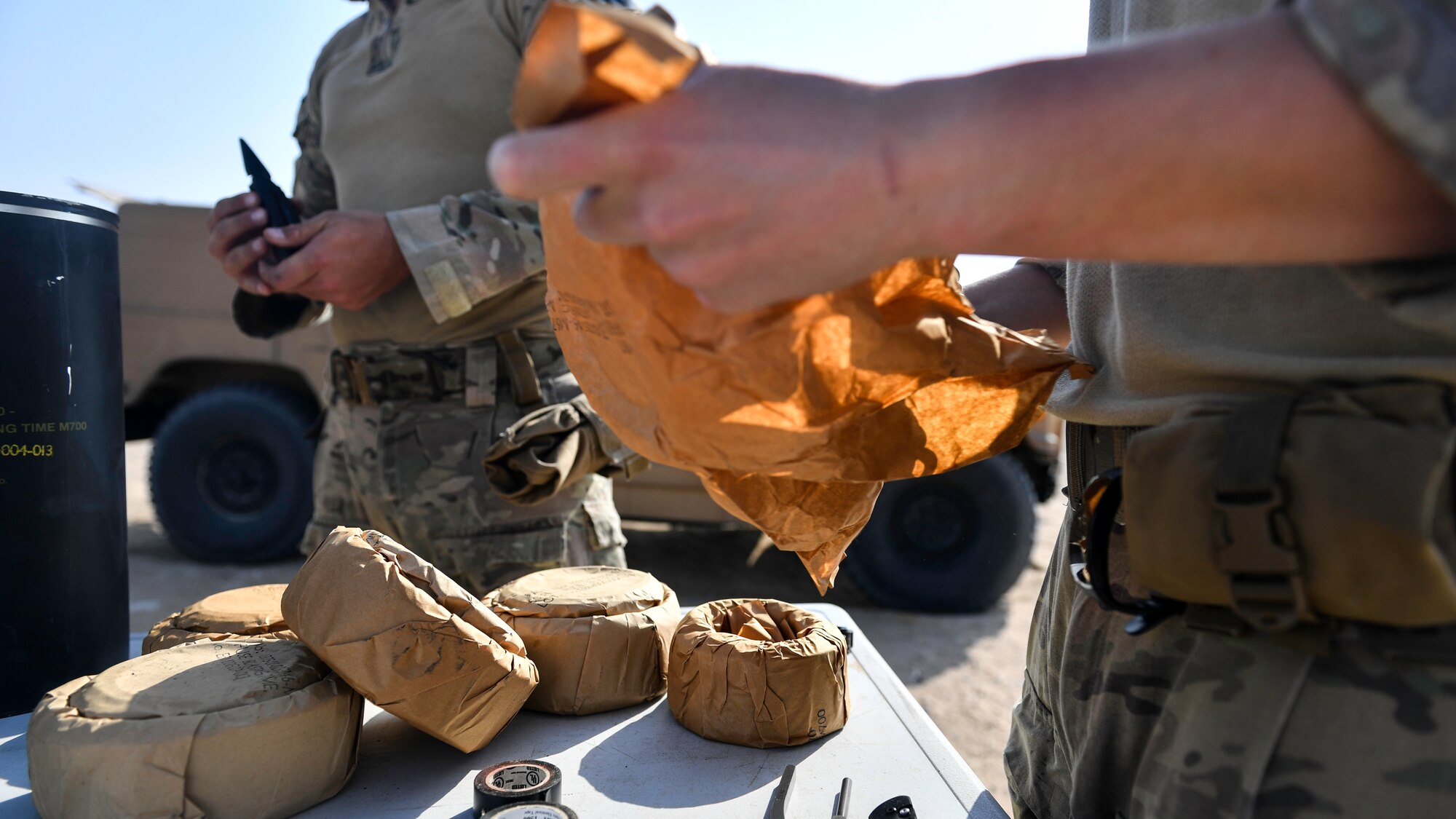 Airmen assigned to the 386th Expeditionary Civil Engineer Squadron explosive ordnance disposal flight at Ali Al Salem Air Base, unpack fuse cords before a rapid airfield damage repair exercise at Udari Range, Kuwait, Sept. 25, 2019. The fuse cord is a non-electronic means to detonate explosives. When lit the fuse cord burns slowly until it reaches the blasting cap to set off the explosive charge.