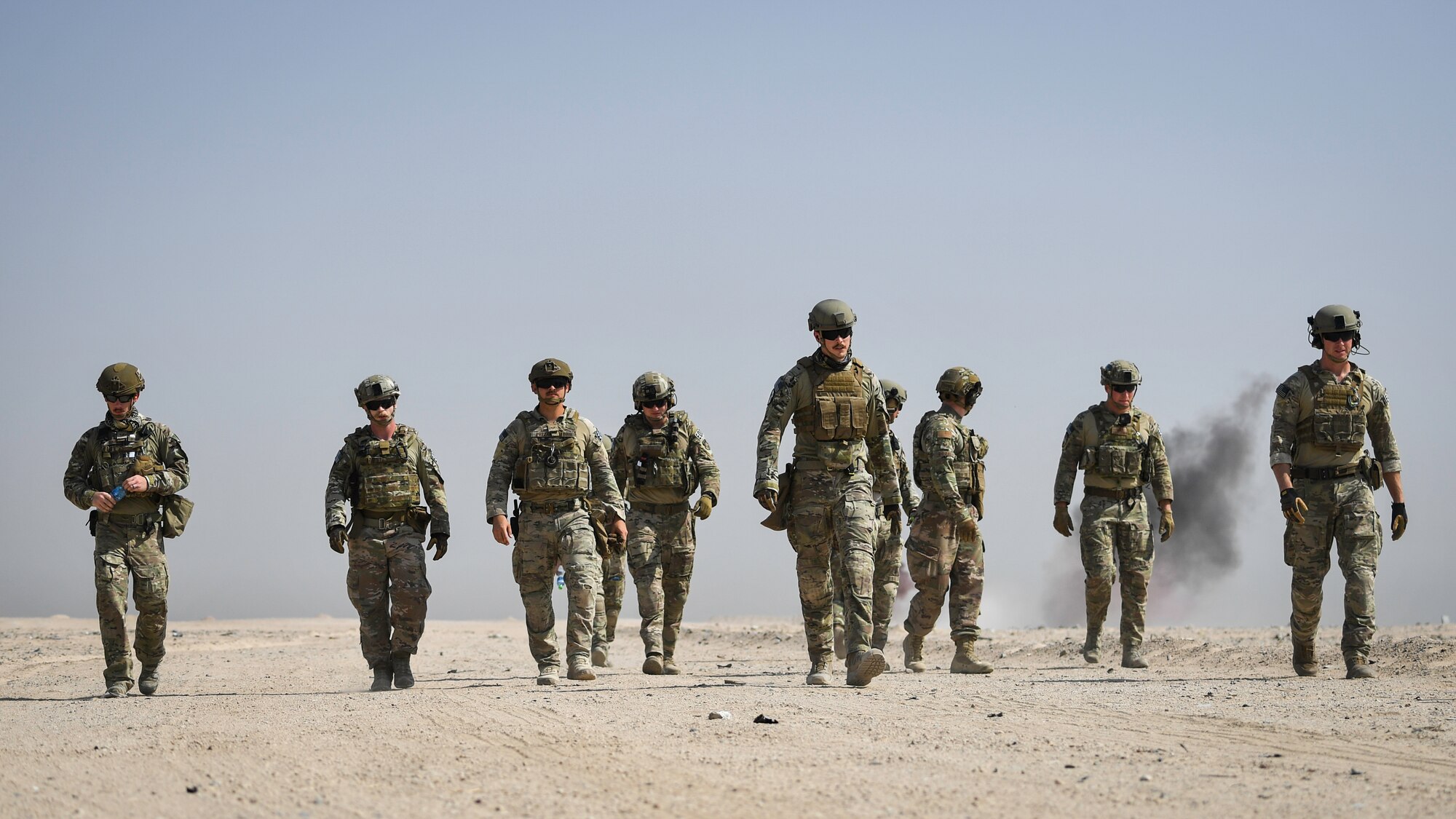Airmen assigned to the 386th Expeditionary Civil Engineer Squadron explosive ordnance disposal flight at Ali Al Salem Air Base, walk away from a blast area during a rapid airfield damage repair exercise at Udari Range, Kuwait, Sept. 25, 2019. During the exercise, Airmen identified explosives and installed igniters, fuses, and blasting caps to high explosives and completed assemblies to simulate leftover munitions before activation