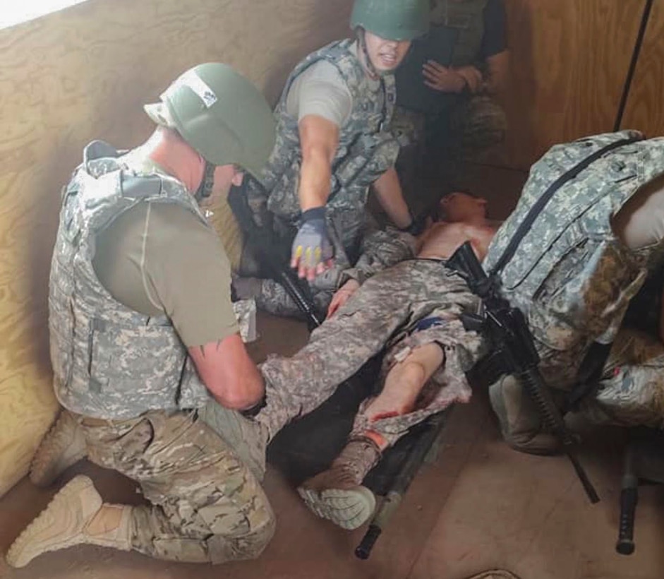 Master Sgt. Darrel Hanrahan and Staff Sgt. David Weiler, 103rd Medical Group aerospace medical technicians, apply Tactical Combat Casualty Care to a patient after a simulated Humvee explosion during the Medic Rodeo at Cannon Air Force Base and Melrose Air Force Range, N.M. Sept. 17-20, 2019. The event, hosted by the 27th Special Operations Medical Group, features 19 Air Force medical technician teams from around the world and trains skills in both deployed and home station scenarios. (U.S. Air National Guard photo)