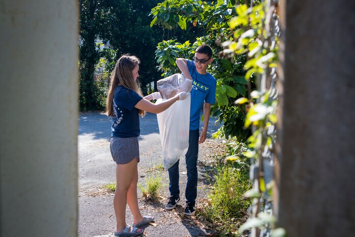 U.S. Navy Hospitalman Apprentice Lynsey Gabrielson, left, and Hospitalman Nathaniel Lovato pick up trash during the monthly Friendship Cleanup Uruma City, Okinawa, Japan on Oct. 5, 2019. Gabrielson and Lavato are dental technicians with 3rd Dental Battalion, and are from Downers Grove, Ill., and Vail, Ariz. respectively. The Single Marine Program coordinates the cleanup every month to provide service members the opportunity to volunteer for community service and build friendly relationships with the local community.