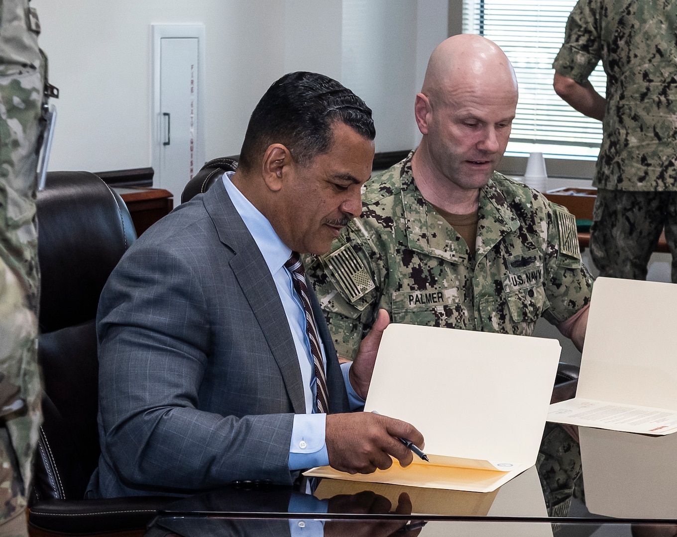 two men look over a charter