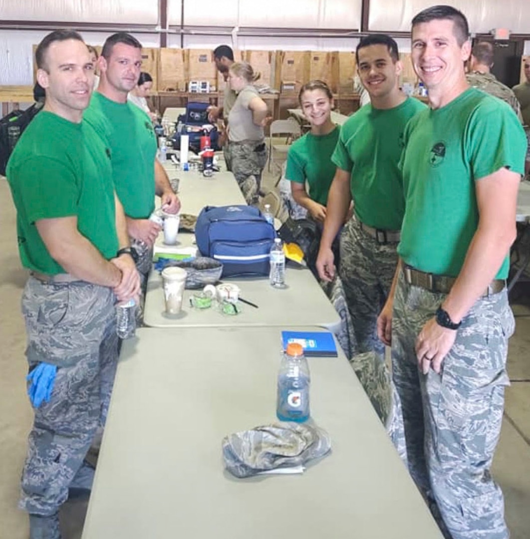 Staff Sgt. David Weiler, Master Sgt. Darrel Hanrahan, 103rd Medical Group aerospace medical technicians, Senior Airman Kayla Walsh, 103rd Medical Group health services technician, Airman 1st Class Andrew Batchelor, and Senior Master Sgt. Michael Machost, 103rd Medical Group aerospace medical technicians, pose for a picture at EMS day during the Medic Rodeo at Cannon Air Force Base and Melrose Air Force Range, N.M. Sept. 17-20, 2019.