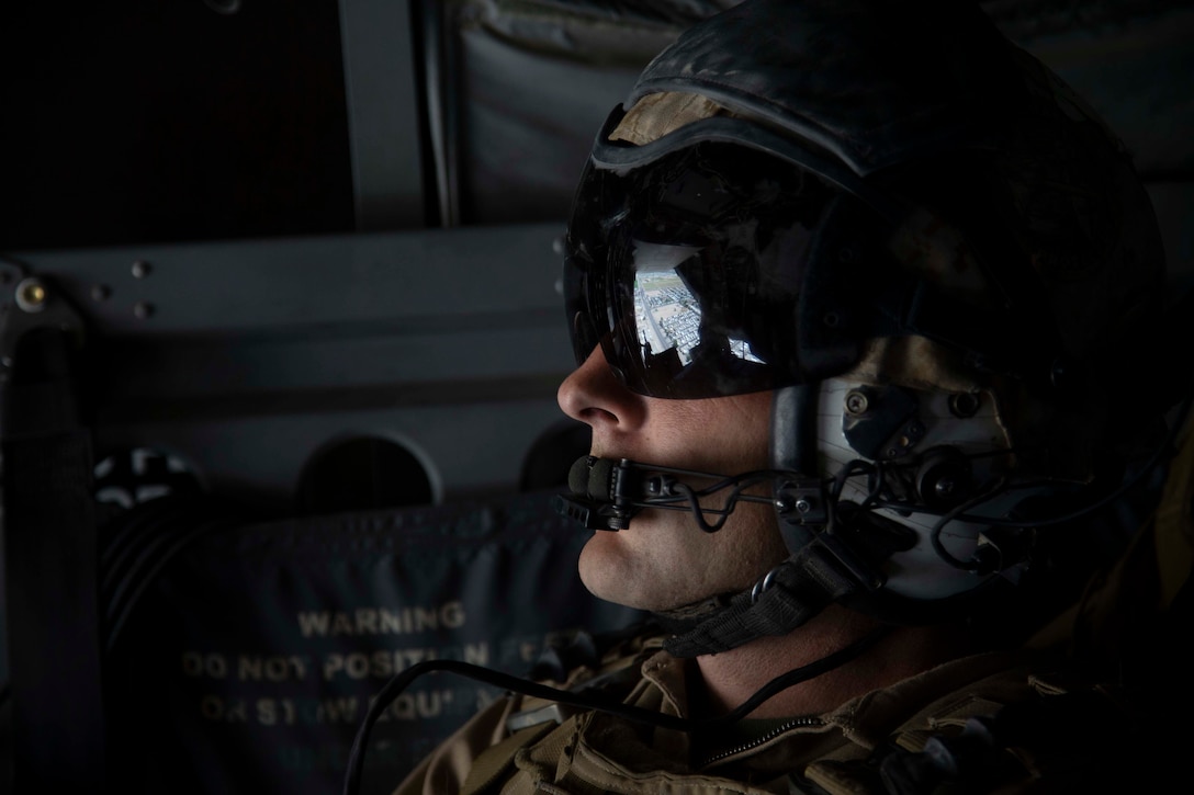 U.S. Marine Corps Sgt. Curtis Anglin, an MV-22B Osprey crew chief with Marine Medium Tiltrotor Squadron 764, Marine Aircraft Group 41, 4th Marine Aircraft Wing, observes terrain in support of a ground threat reaction exercise during Weapons and Tactics Instructor course 1-20 in Wellton, Arizona, Oct. 3, 2019. WTI is a seven-week training event hosted by Marine Aviation Weapons and Tactics Squadron One, which emphasizes operational integration of the six functions of Marine Corps aviation in support of a Marine Air Ground Task Force. WTI also provides standardized advanced tactical training and certification of unit instructor qualifications to support Marine aviation training and readiness, and assists in developing and employing aviation weapons and tactics.
