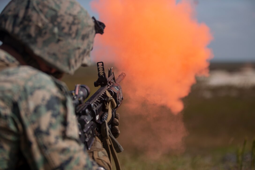 A U.S. Marine with Bravo Company, 2nd Law Enforcement Battalion, II Marine Expeditionary Force Information Group, fires an M203 grenade launcher during weapons familiarization training range at Camp Lejeune, N.C., Sep 30, 2019. The purpose of the training is to improve accuracy, communication abilities and suppressive fire capabilities with the MK-19 and M203 grenade launcher.