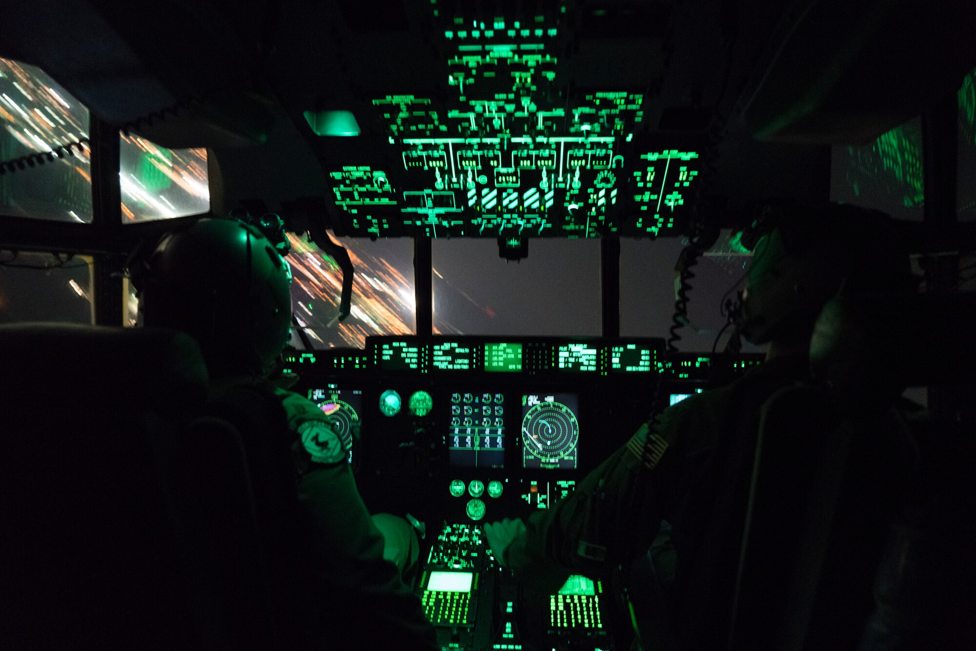 Maj. Nick Foreman (left) and Maj. Chris Bean (right), 815th Airlift Squadron pilots, fly a C-130J Super Hercules aircraft toward Gulfport Combat Readiness Training Center, Miss. Oct. 2, 2019. The 815th AS, aka ‘Flying Jennies,’ with the 327th AS, provided airlift and airdrop support for the U.S. Army’s Joint Forces Exercise Arctic Anvil, Oct. 1 to 6. (U.S. Air Force photo by Tech. Sgt. Christopher Carranza)