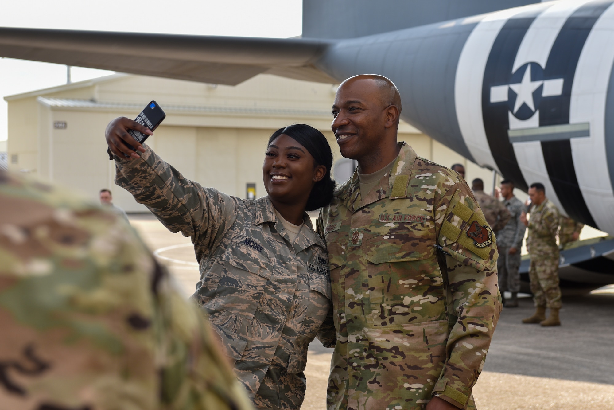 An Airman takes a selfie with Chief Wright