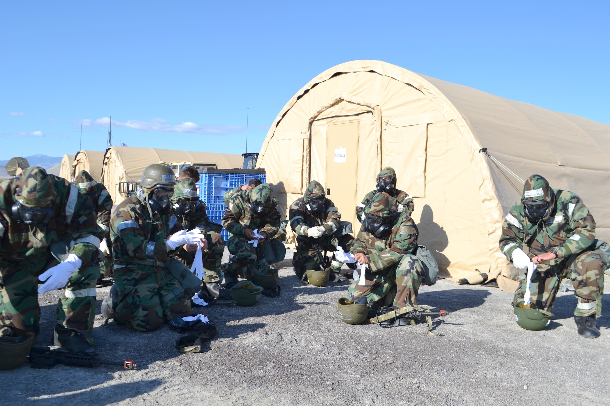 Airmen from 729th Air Control Squadron during a chemical, biological, radiological, and nuclear exercise Sept. 21, 2019 at a base camp at Wendover Field, Utah. The Airmen were participating in the squadron’s annual Raging Bull exercise, where they set up a remote radar site to extend the unit's capability to control aircraft. (Courtesy photo by Master Sgt. Daniel Lane)