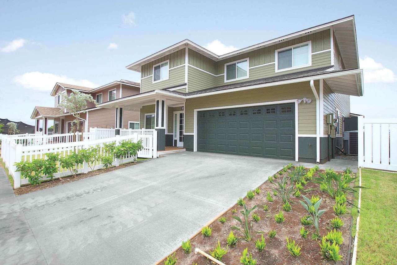 A large house and a big driveway.