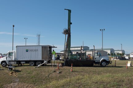 Cascade Drilling, LLC, uses a sonic rig to drill a monitoring well at the 167th Airlift Wing, West Virginia Air National Guard, Sept. 25, 2019.  The drilling is part of an expanded site investigation for per- and polyfluoroalkyl substances (PFAS) in and around the Martinsburg, W.Va. air base. The 167th AW's use of aqueous film forming foam, AFFF, for fighting petroleum fires, contained PFAS, and is thought to have migrated to the Big Springs Deep Well which provides water for the City of Martinsburg. The Environmental Protection Agency issued a drinking water advisory for PFOA and PFOS in 2016. (U.S. Air National Guard photo by Senior Master Sg. Emily Beightol-Deyerle)