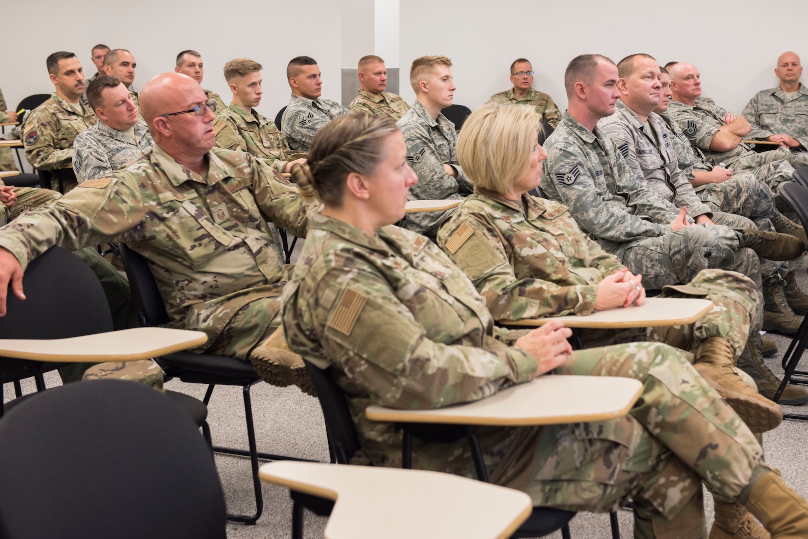 Airmen listen to a presentation on Airmen resilience during the 167th Airlift Wing's Full Spectrum Wellness Day, Oct. 6, 2019. The 167th Airlift Wing paused normal unit training assembly activities for the day to focus on wellness and resilience as part of an Air Force-wide initiative to address a spike in suicides across the force this year. (U.S. Air National Guard photo by Senior Master Sgt. Emily Beightol-Deyerle)