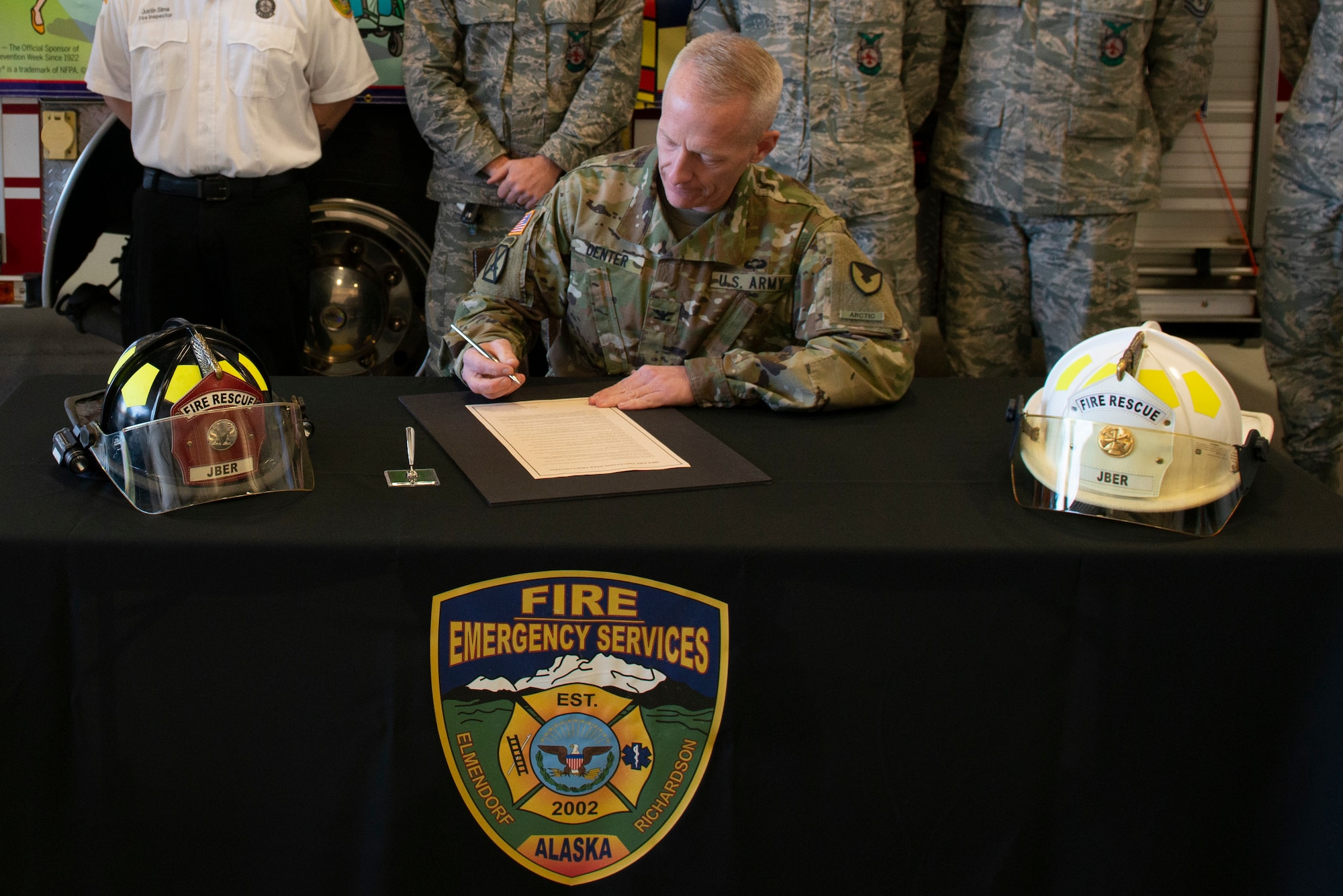U.S. Army Col. Dean Denter, Joint Base Elmendorf-Richardson and 673d Air Base Wing vice commander, signs the JBER Fire Prevention Week Proclamation during a JBER Fire and Emergency Services open house at Fire Station 3 on JBER, Alaska, Oct. 5, 2019. The open house kicked off this year’s Fire Prevention Week, a week to promote preparation for emergencies.