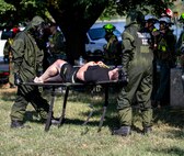 U.S. Marines with Chemical Biological Incident Response Force, carry a notional casualty during Capital Shield 19, on Fort McNair, District of Columbia, Sep. 4, 2019. Capital Shield is an exercise to train and prepare emergency responders in the National Capital Region for chemical exposure and response. (U.S. Marine Corps photo by Lance Cpl. Sarah N. Petrock)
