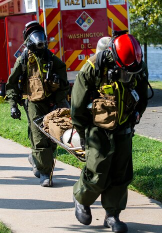 District of Columbia Firefighters check their oxygen tanks during Capital Shield 19, on Fort McNair, District of Columbia, Sep. 4, 2019. Capital Shield is an exercise to train and prepare emergency responders in the National Capital Region for chemical exposure and response. (U.S. Marine Corps photo by Lance Cpl. Sarah N. Petrock)