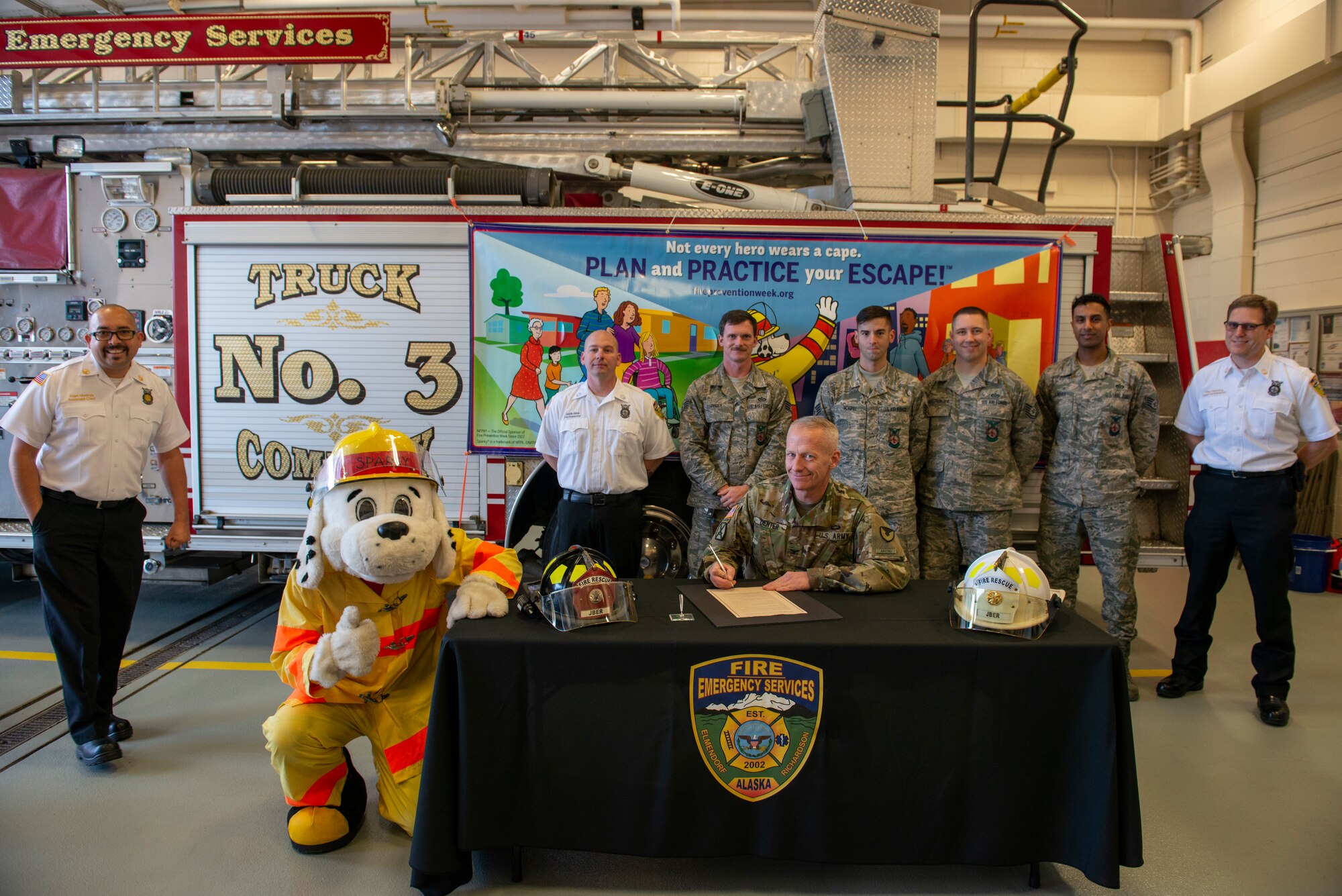 U.S. Army Col. Dean Denter, Joint Base Elmendorf-Richardson and 673d Air Base Wing vice commander, signs the JBER Fire Prevention Week Proclamation during a JBER Fire and Emergency Services open house at Fire Station 3 on JBER, Alaska, Oct. 5, 2019. The open house kicked off this year’s Fire Prevention Week, a week to promote preparation for emergencies.