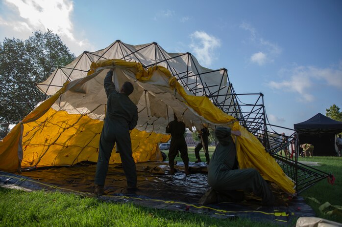 U.S. Marines with Chemical Biological Incident Response Force, set up a decontamination tent during Capital Shield 19, on Fort McNair, District of Columbia, Sep. 4, 2019. Capital Shield is an exercise to train and prepare emergency responders in the National Capital Region for chemical exposure and response. (U.S. Marine Corps photo by Lance Cpl. Sarah N. Petrock)