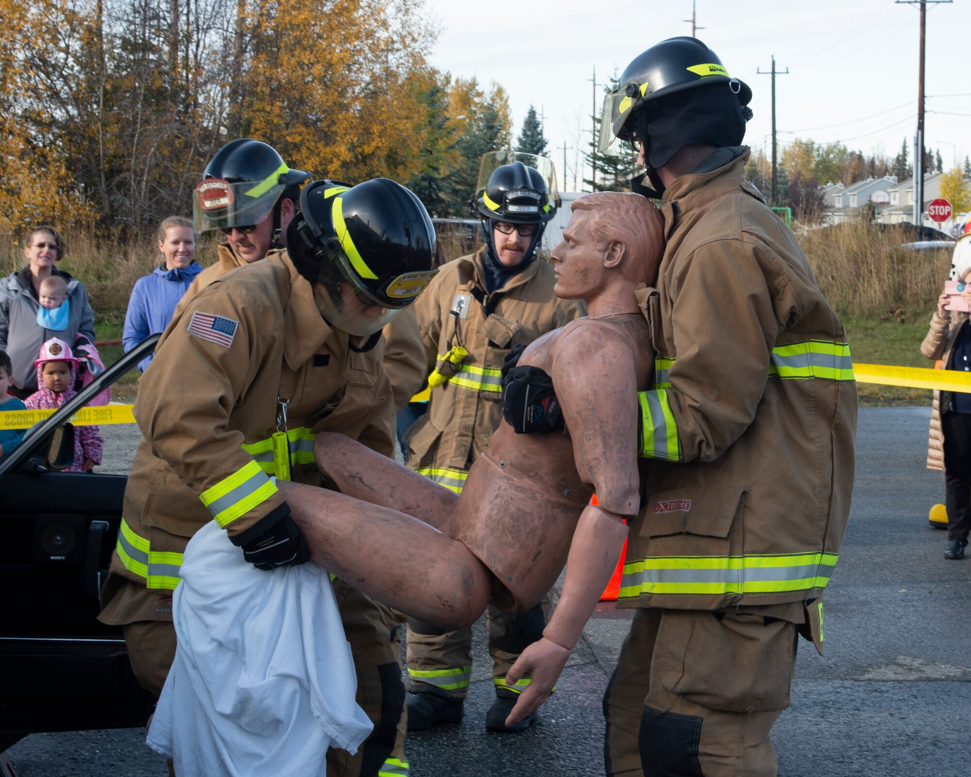 Firefighters with 673d Civil Engineer Squadron Fire and Emergency Services demonstrate how to remove a victim from a vehicle in an emergency during a Joint Base Elmendorf-Richardson Fire and Emergency Services open house at Fire Station 3 on JBER, Alaska, Oct. 5, 2019. The open house kicked off this year’s Fire Prevention Week, a week to promote preparation for emergencies.