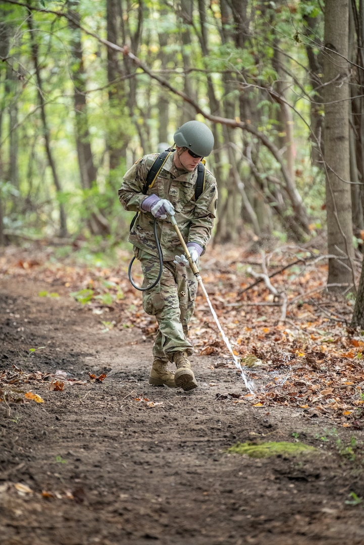 A soldier of the West Virginia Army National Guard’s 249th Army Band sprays a defensive fire break barrier mixture from a backpack unit during basic wildland fire suppression training, conducted by the West Virginia Division of Forestry in Morgantown, West Virginia, Oct. 3, 2019. The training covered basic wildland fire fighting techniques including understanding fire behavior, suppression tactics and techniques, crew organization, communications, and crew safety and awareness, with the goal of providing WNVG Soldiers the basic skills and experience to operate on a fire line side-by-side with experienced Division of Forestry personnel. (U.S. Army National Guard photo by Edwin L. Wriston)