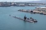 JOINT BASE PEARL HARBOR-HICKAM (Sept. 20, 2019) -- Cmdr. Chad Hardt, from Aiken, South Carolina, salutes the ensign during a change of command ceremony for the Los Angeles-class fast-attack submarine USS Tucson (SSN 770) on the submarine piers, Sept. 20. Cmdr. Douglas Pratt, from Nashua, New Hampshire, relieved Hardt as Tucson’s commanding officer. (U.S. Navy photo by Mass Communication Specialist 1st Class Michael B. Zingaro/Released)