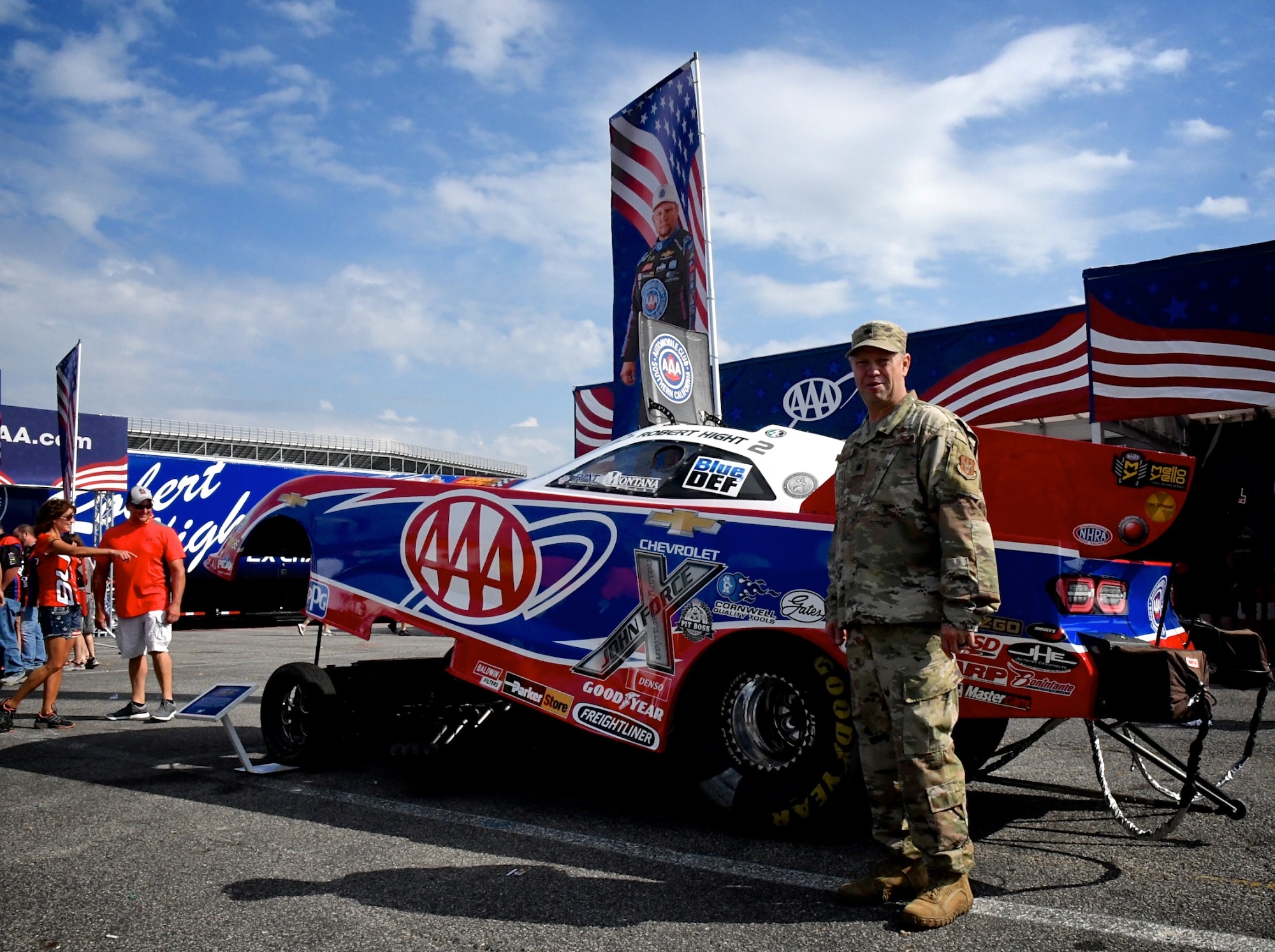 The National Hot Rod Association held their Midwest Nationals at the World Wide Technology Raceway at Gateway Motorsports, Madison Illinois, with Lt. Col. William McLeod, 932nd Maintenance Group commander, invited to help start the event as an honored guest, Sept. 29, 2019.  McLeod was brought on stage during the opening ceremony and presented an NHRA challenge coin and waved to the cheering crowd.  The 932nd Airlift Wing is known as "the Gateway Wing" in the Air Force Reserve Command and flies four C-40 aircraft around the world for distinguished visitor airlift.  (U.S. Air Force photo by Lt. Col. Stan Paregien)