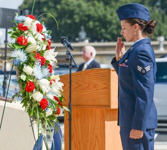 A U.S. Air Force Airman with the Twenty-Fifth Air Force salutes a wreath laid in tribute during the annual headquarters remembrance ceremony at Joint Base San Antonio-Lackland Oct. 4. More than 5,600 of the community’s brothers and sisters have perished, and the names of more than 130 of the most recent losses were read during the ceremony.