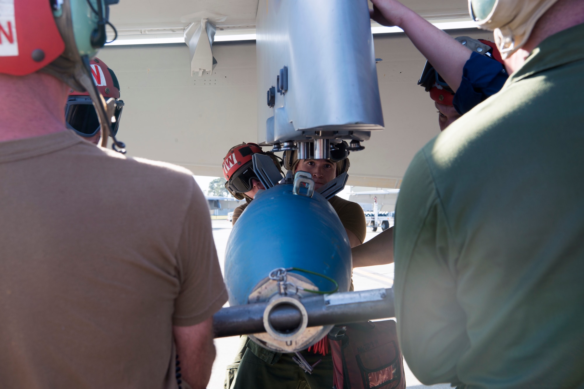 U.S. Navy Sailors with the Strike Fighter Squadron 106 from Naval Air Station Oceania, Va., attach a training ordnance to an F/A-18F Super Hornet aircraft at MacDill Air Force Base, Fla., Oct. 4, 2019.