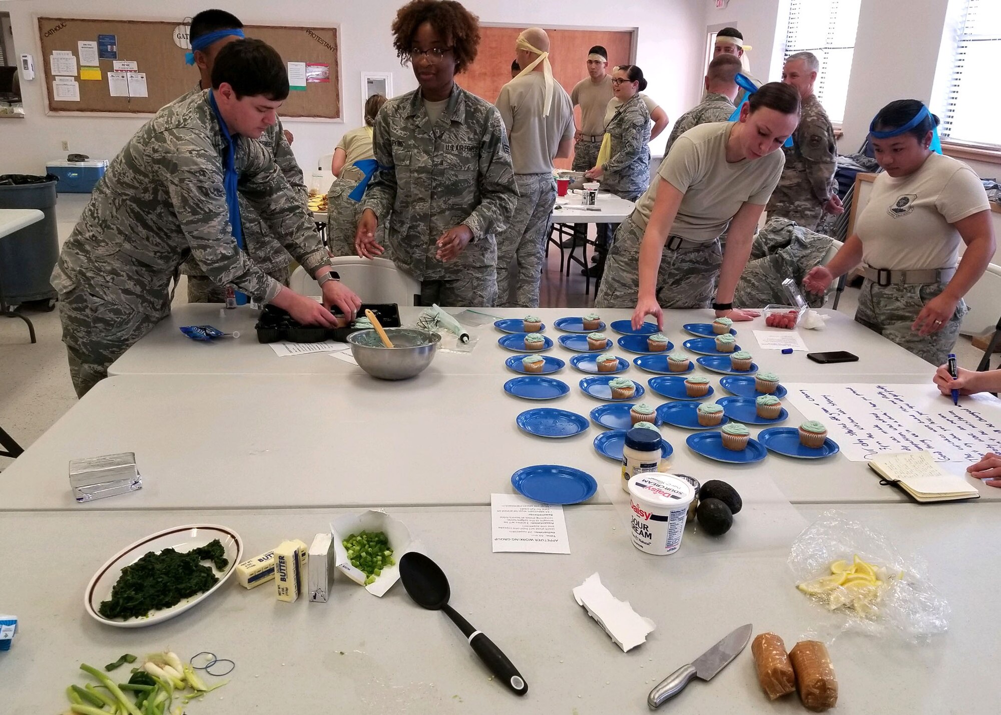 Airmen from the 49th Aerospace Medicine Squadron decorate cupcakes during a Unite program on Holloman Air Force Base, N.M. The program provides funds for 36 squadrons across the 49th Wing, to plan cohesion events. Each Airman is allotted $5 for food and beverage and $17.50 for programs and activities. (Courtesy Photo)