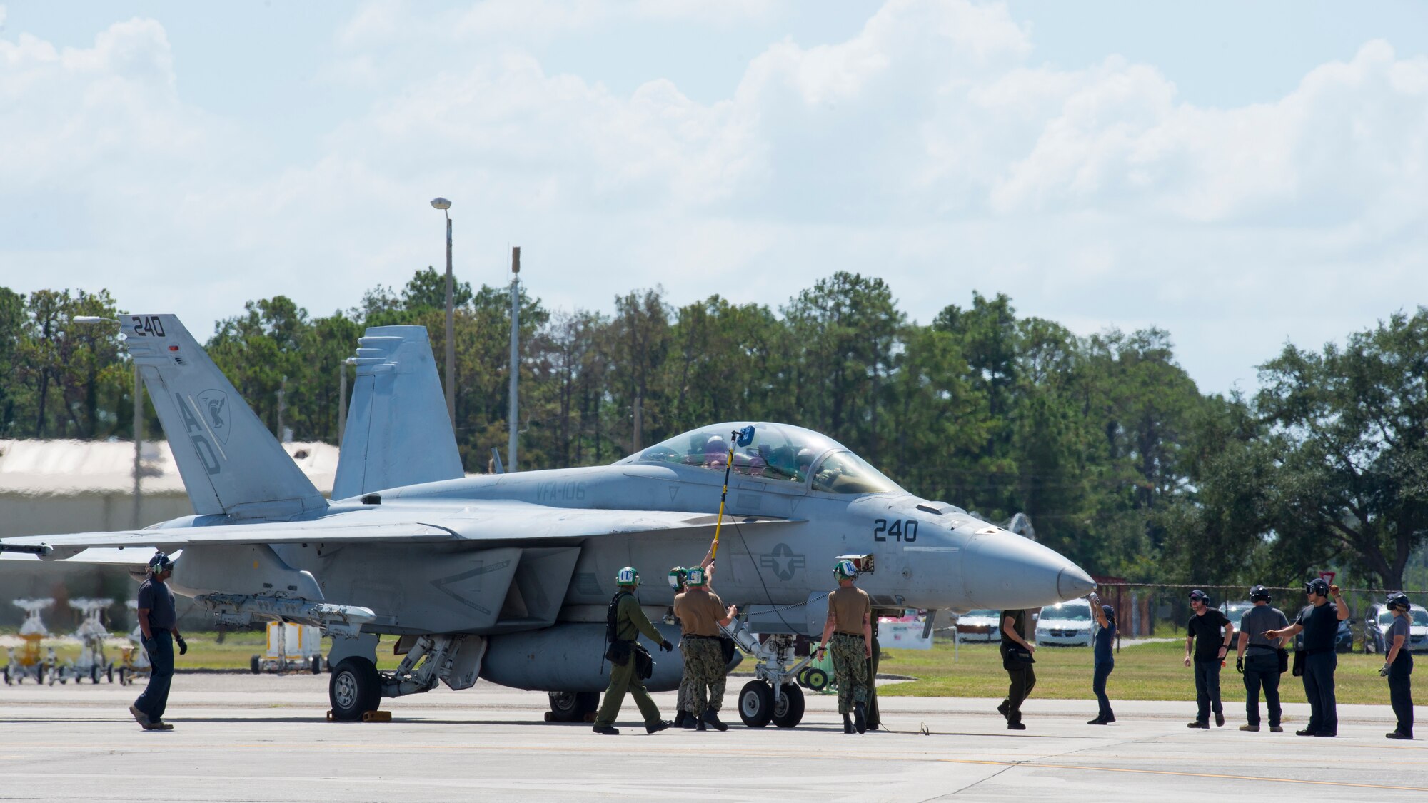 U.S. Navy Sailors with the Strike Fighter Squadron 106 from Naval Air Station Oceania, Va., wash and marshal in an F/A-18F Super Hornet aircraft at MacDill Air Force Base, Fla., Oct. 1, 2019.