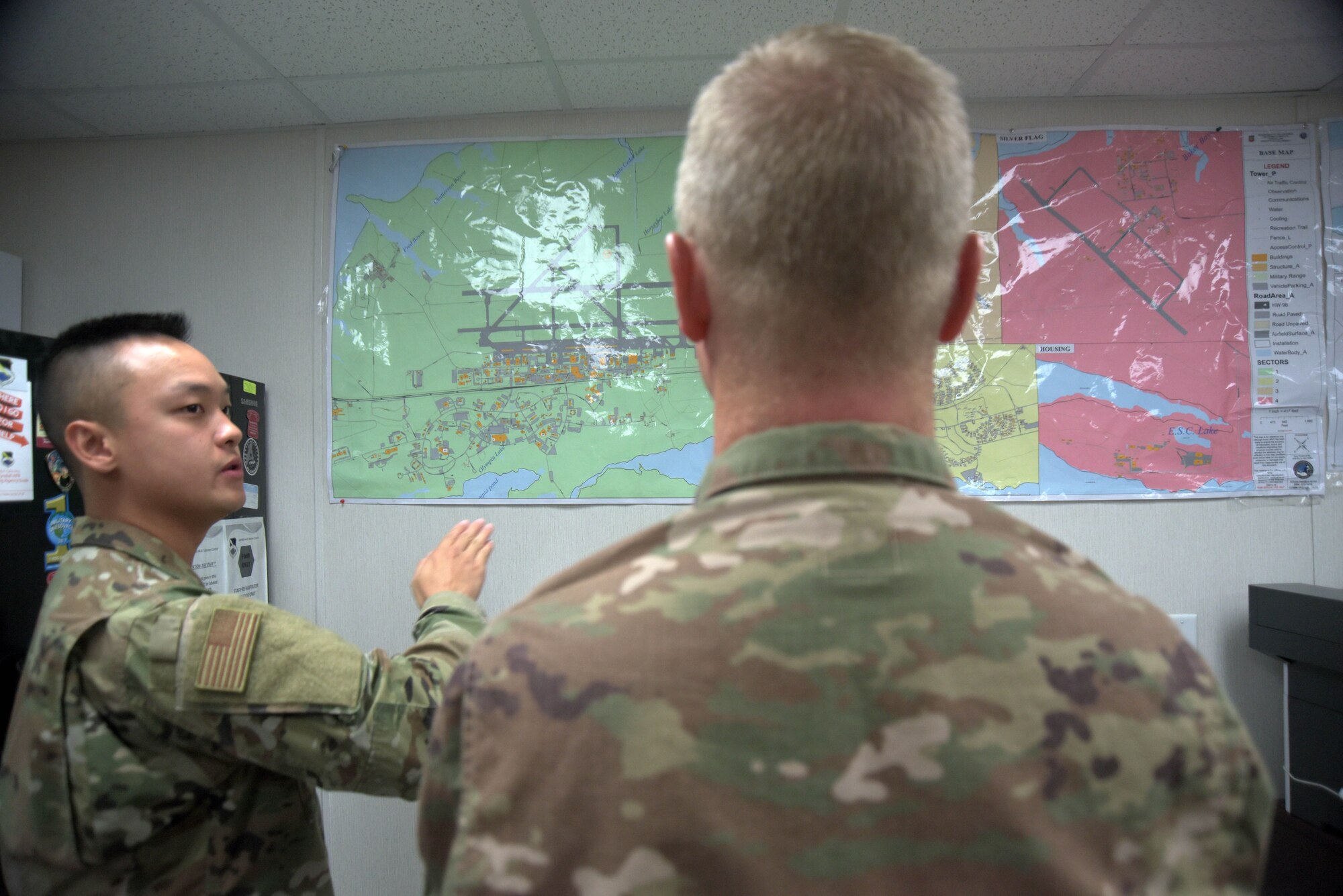 Airman 1st Class Brian Nguyen, 325th Operational Medical Readiness Squadron Ambulance Services Department medic, left, briefs Col. Brian Laidlaw, 325th Fighter Wing commander, right, on Oct. 4, 2019, at Tyndall Air Force Base, Florida. Several maps depict the designated area of responsibility the 325th OMRS ASD has both inside and outside of the installation’s borders. (U.S. Air Force photo by Staff Sgt. Magen M. Reeves)