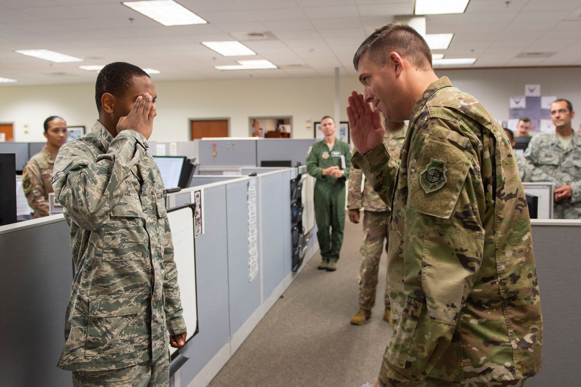 Col. Daniel Walls, right, 23d Wing commander, coins Airman 1st Class Miles Clark, 23d Comptroller Squadron financial operations technician, Oct. 7, 2019, at Moody Air Force Base, Ga. Clark was recognized for completing his Career Development Course in six months while studying for the Scholastic Assessment Test with the goal of being accepted into the U.S. Air Force Academy. Walls visited different components of Moody’s Wing Staff Agency to acknowledge their contributions to the mission. (U.S. Air Force photo by Airman Azaria E. Foster)
